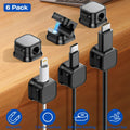 Magnetic cable clips holding chargers